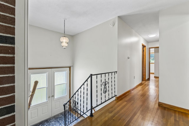 232 Augusta Rd, Topsham, ME 04086 - entryway featuring hardwood / wood-style floors and a chandelier