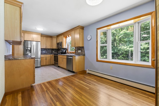 232 Augusta Rd, Topsham, ME 04086 - kitchen with appliances with stainless steel finishes, a baseboard radiator, light wood-style floors, and backsplash