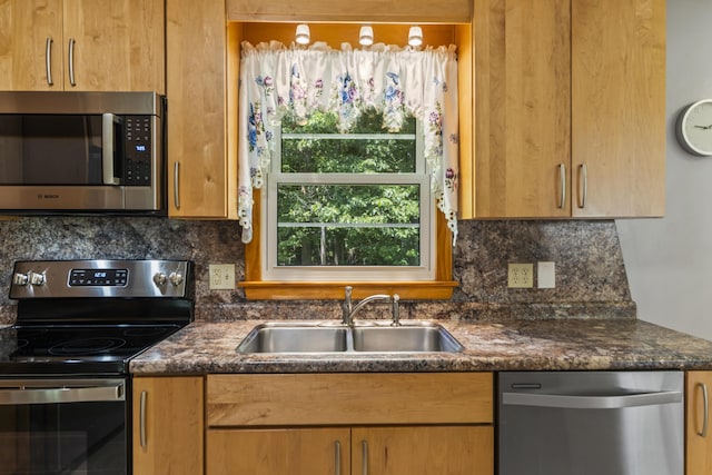 232 Augusta Rd, Topsham, ME 04086 - kitchen with appliances with stainless steel finishes, decorative backsplash, and dark stone counters