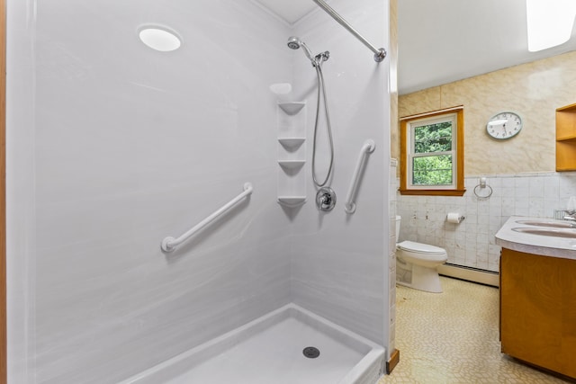 232 Augusta Rd, Topsham, ME 04086 - full bathroom featuring tile walls, vanity, a shower, a baseboard heating unit, and wainscoting