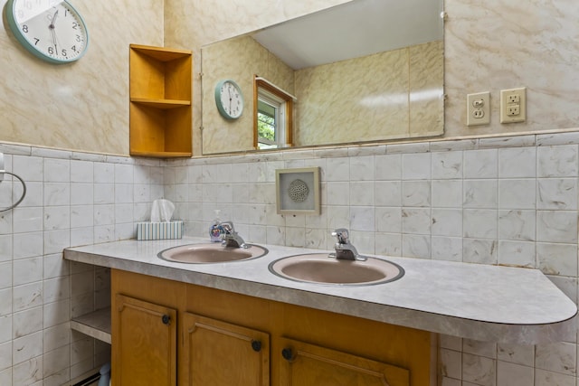 232 Augusta Rd, Topsham, ME 04086 - bathroom featuring double vanity and tile walls