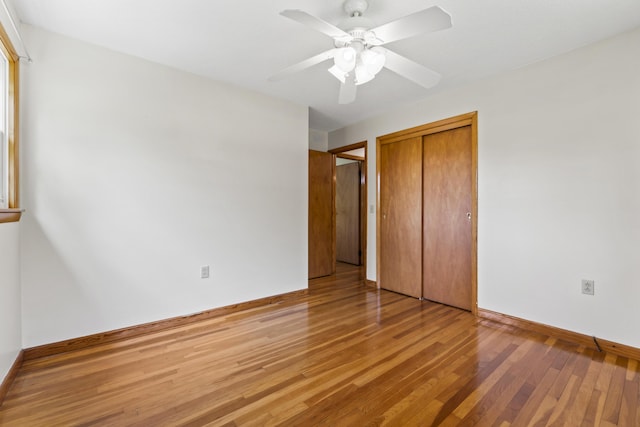 232 Augusta Rd, Topsham, ME 04086 - unfurnished bedroom featuring light wood-style flooring, a closet, and a ceiling fan