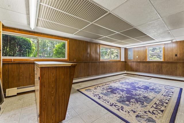 232 Augusta Rd, Topsham, ME 04086 - unfurnished room with wood walls, baseboard heating, electric panel, and light floors