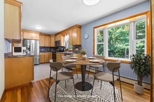 232 Augusta Rd, Topsham, ME 04086 - kitchen with appliances with stainless steel finishes, backsplash, and light wood-style floors