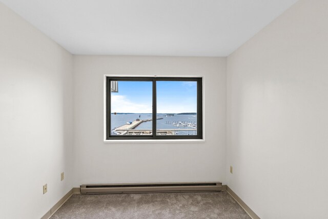 148 Breakwater Dr Unit 808, South Portland, ME 04106 - empty room with a baseboard heating unit and carpet