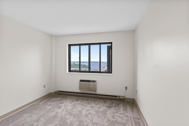 148 Breakwater Dr Unit 808, South Portland, ME 04106 - carpeted empty room with a wall mounted AC and a baseboard heating unit