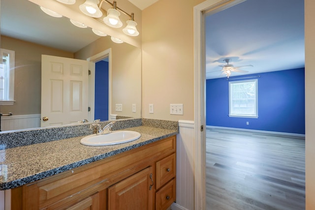 18 Wilson Dr, Westbrook, ME 04092 - bathroom with a wainscoted wall, vanity, wood finished floors, and a ceiling fan