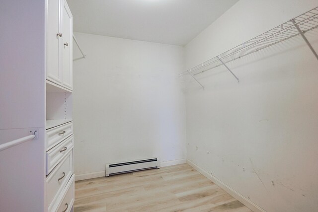 18 Wilson Dr, Westbrook, ME 04092 - spacious closet featuring a baseboard radiator and light wood-style floors
