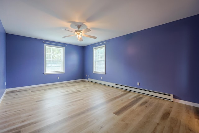 18 Wilson Dr, Westbrook, ME 04092 - empty room featuring a baseboard radiator, a ceiling fan, and wood finished floors