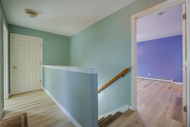 18 Wilson Dr, Westbrook, ME 04092 - corridor featuring a baseboard radiator, an upstairs landing, and wood finished floors