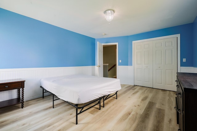 18 Wilson Dr, Westbrook, ME 04092 - bedroom featuring wainscoting, light wood-style floors, and a closet