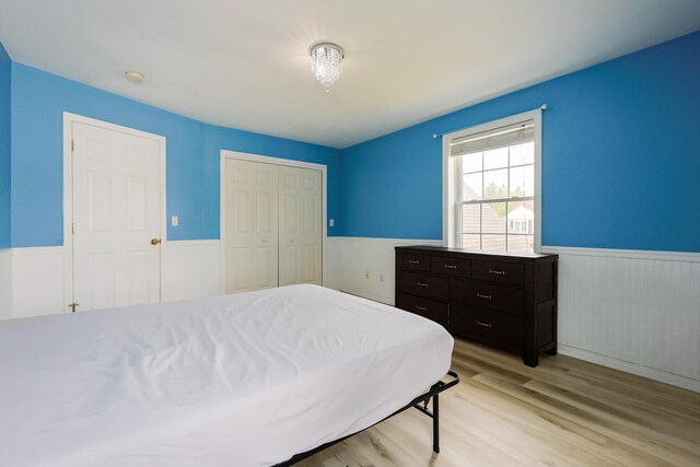 18 Wilson Dr, Westbrook, ME 04092 - bedroom featuring wainscoting, light wood-style flooring, and a closet