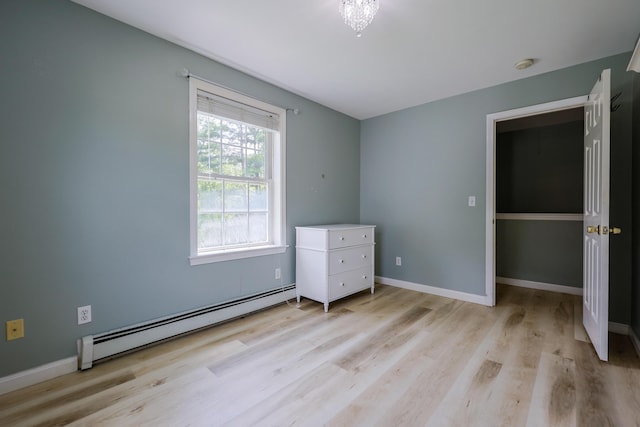 18 Wilson Dr, Westbrook, ME 04092 - unfurnished bedroom featuring a baseboard radiator and light wood-type flooring