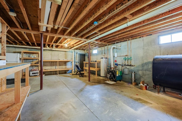 18 Wilson Dr, Westbrook, ME 04092 - basement with heating fuel, water heater, and a heating unit
