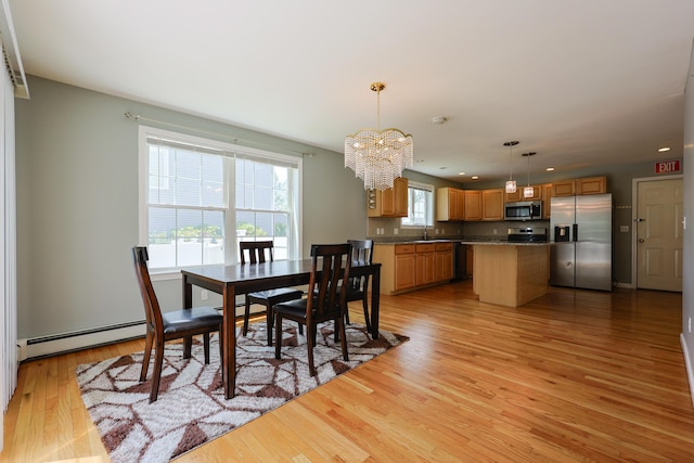 18 Wilson Dr, Westbrook, ME 04092 - dining area featuring a chandelier, light wood finished floors, baseboard heating, and recessed lighting