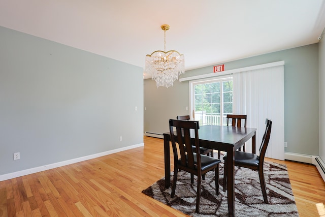 18 Wilson Dr, Westbrook, ME 04092 - dining space featuring a chandelier, light wood-style floors, and a baseboard radiator