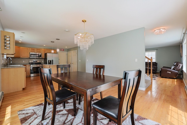 18 Wilson Dr, Westbrook, ME 04092 - dining room featuring light wood-style flooring, a chandelier, recessed lighting, and a baseboard radiator