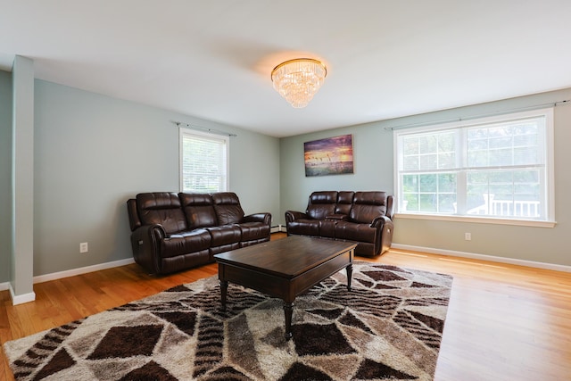18 Wilson Dr, Westbrook, ME 04092 - living room with wood finished floors, plenty of natural light, and baseboard heating
