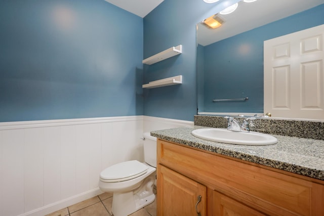 18 Wilson Dr, Westbrook, ME 04092 - half bathroom featuring vanity, wainscoting, and tile patterned floors