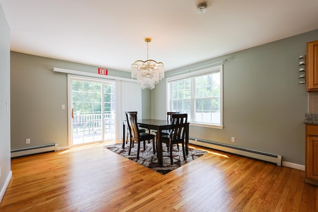 18 Wilson Dr, Westbrook, ME 04092 - dining room featuring baseboard heating, a chandelier, light wood-style floors, and plenty of natural light