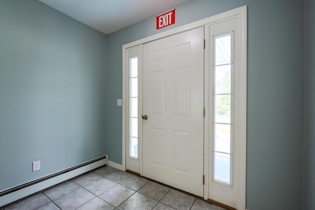 18 Wilson Dr, Westbrook, ME 04092 - entrance foyer with baseboard heating, light tile patterned flooring, and plenty of natural light