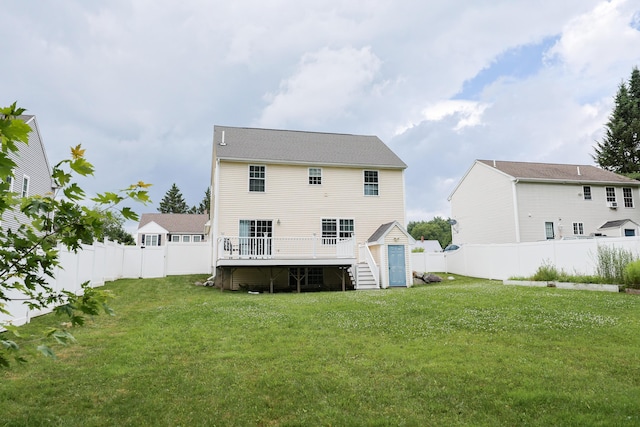 18 Wilson Dr, Westbrook, ME 04092 - back of property with a storage unit, a fenced backyard, and a wooden deck