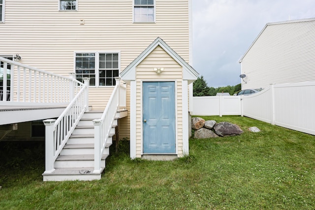 18 Wilson Dr, Westbrook, ME 04092 - rear view of house with a fenced backyard and stairway