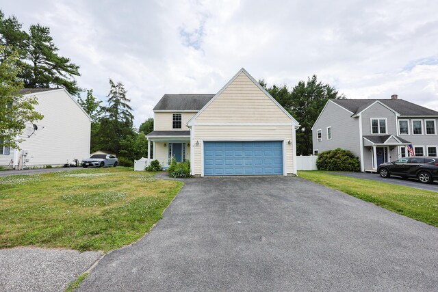 18 Wilson Dr, Westbrook, ME 04092 - traditional home with asphalt driveway and an attached garage