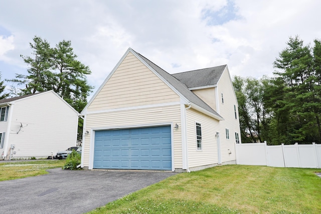 18 Wilson Dr, Westbrook, ME 04092 - view of side of home featuring asphalt driveway and an attached garage
