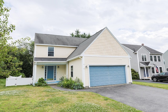 18 Wilson Dr, Westbrook, ME 04092 - traditional-style home featuring a garage and asphalt driveway
