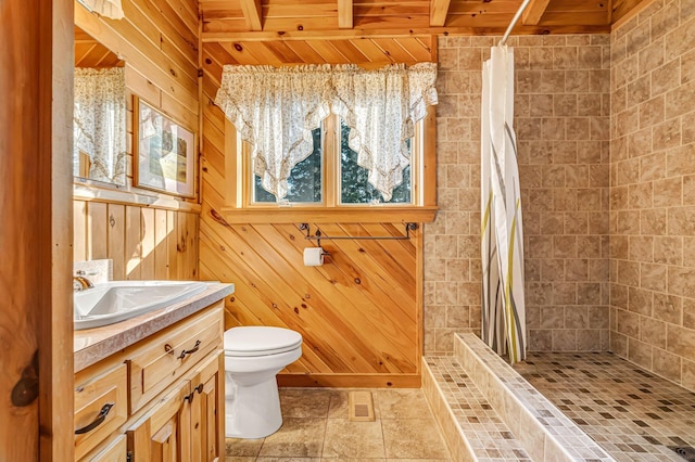 642 Mingo Loop Rd, Rangeley, ME 04970 - bathroom with vanity, tiled shower, wooden walls, and a wood ceiling with exposed beams