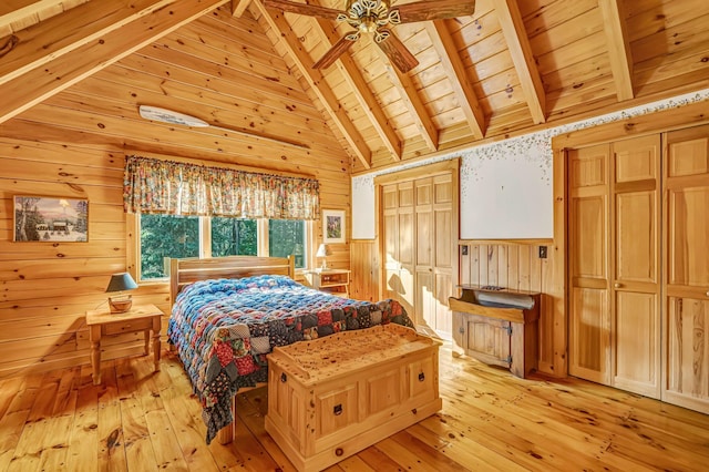 642 Mingo Loop Rd, Rangeley, ME 04970 - bedroom featuring light wood-type flooring, a wood ceiling with exposed beams, wooden walls, a wainscoted wall, and high vaulted ceiling