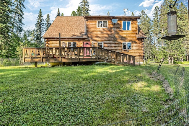 642 Mingo Loop Rd, Rangeley, ME 04970 - rear view of house featuring log exterior, a fenced backyard, a deck, and roof with shingles