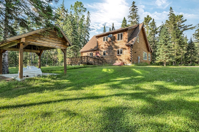 642 Mingo Loop Rd, Rangeley, ME 04970 - view of side of property with a yard, a deck, log siding, and a gazebo