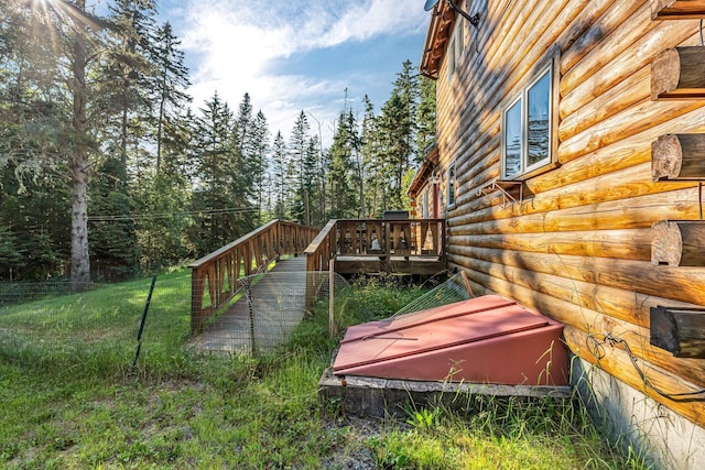 642 Mingo Loop Rd, Rangeley, ME 04970 - view of property exterior with log siding and a wooden deck