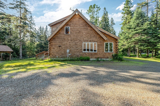 642 Mingo Loop Rd, Rangeley, ME 04970 - view of home's exterior with log exterior
