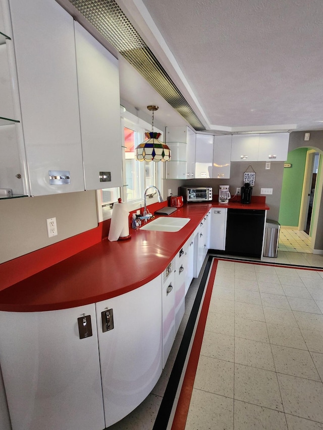 69 Scott Dr, Monmouth, ME 04259 - kitchen with white cabinets, dark countertops, modern cabinets, and hanging light fixtures