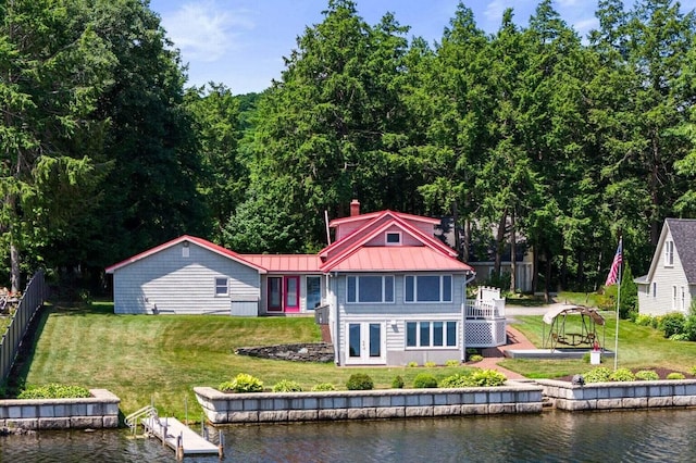 69 Scott Dr, Monmouth, ME 04259 - rear view of house featuring french doors, a standing seam roof, a metal roof, and a yard