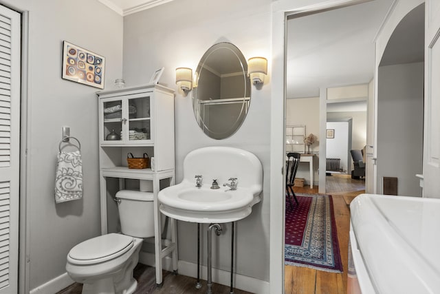 15 Winter St, Topsham, ME 04086 - bathroom featuring radiator heating unit, wood finished floors, and a closet