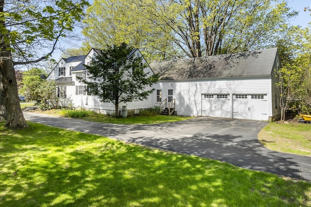 15 Winter St, Topsham, ME 04086 - view of front of property with a garage, a front lawn, and driveway