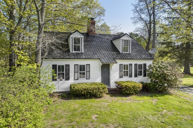 15 Winter St, Topsham, ME 04086 - cape cod house featuring a front lawn, a metal roof, and a chimney