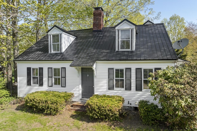 15 Winter St, Topsham, ME 04086 - cape cod-style house with a chimney and a metal roof