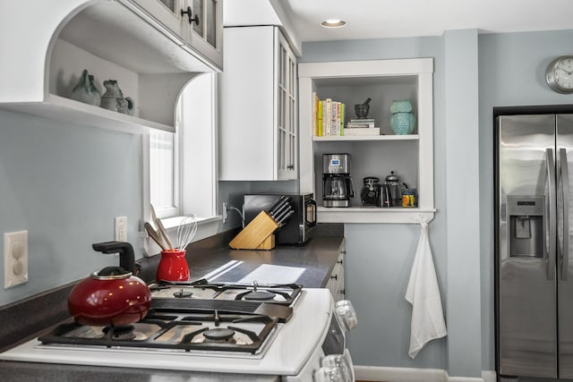 15 Winter St, Topsham, ME 04086 - kitchen featuring stainless steel fridge, black microwave, open shelves, range, and white cabinetry
