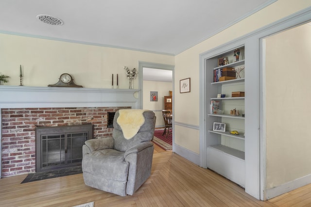 15 Winter St, Topsham, ME 04086 - living area with a fireplace, parquet flooring, and ornamental molding
