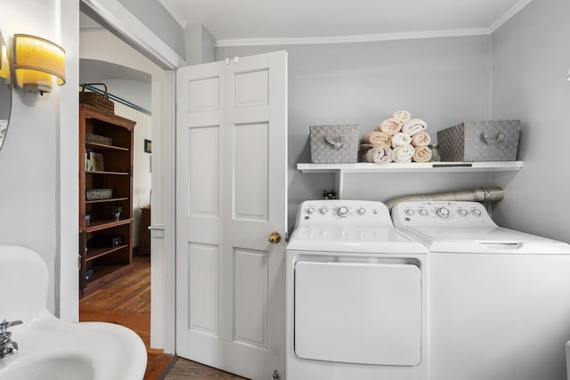 15 Winter St, Topsham, ME 04086 - laundry area with washer and dryer, wood finished floors, and ornamental molding