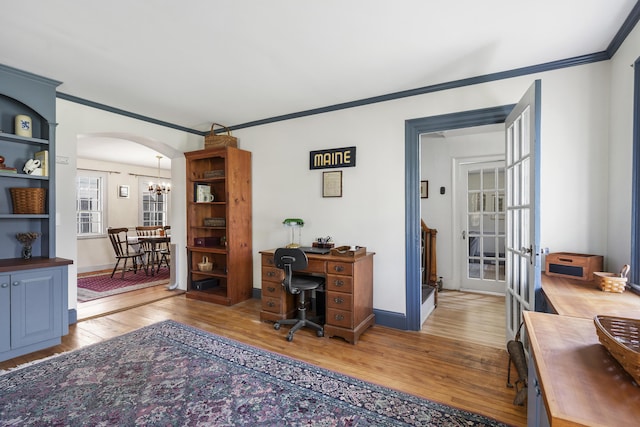 15 Winter St, Topsham, ME 04086 - office area featuring wood finished floors, french doors, crown molding, arched walkways, and a chandelier