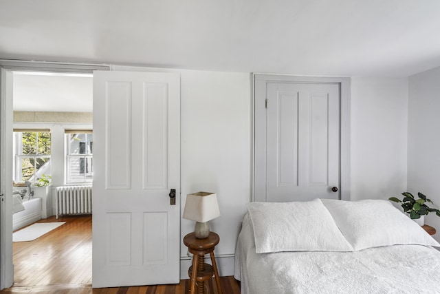 15 Winter St, Topsham, ME 04086 - bedroom featuring radiator and wood finished floors