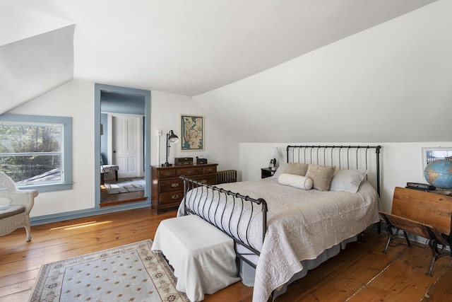 15 Winter St, Topsham, ME 04086 - bedroom with wood-type flooring, vaulted ceiling, and multiple windows