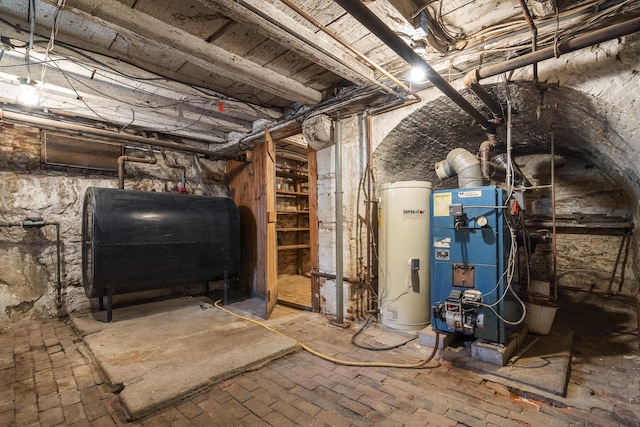 15 Winter St, Topsham, ME 04086 - unfinished below grade area featuring oil tank, water heater, and a heating unit