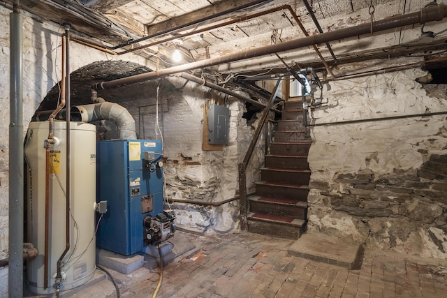 15 Winter St, Topsham, ME 04086 - unfinished basement with gas water heater, electric panel, stairs, and a heating unit